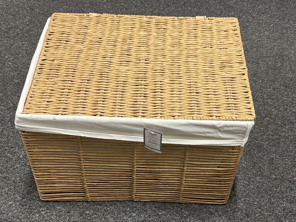 Lot 293: A large Dunelm woven storage trunk with fabric liner