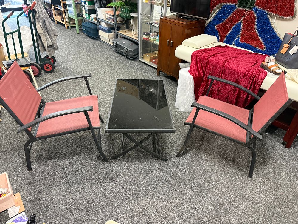 Lot 302: A three piece garden furniture set with bistro chairs