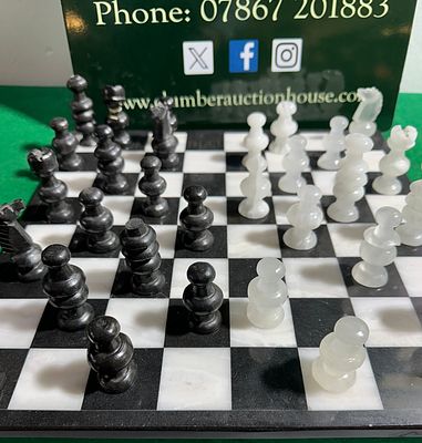 NOVICA Classic Duel Hand-Carved Marble and Onyx Chess Set. A NOVICA Classic Duel hand-carved 