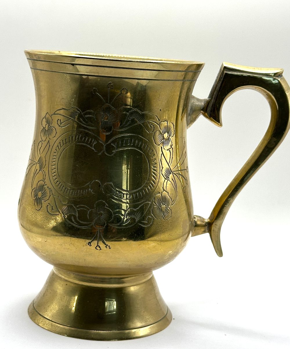 A Vintage Engraved Brass Tankard. A vintage engraved brass tankard. This decorative vessel 