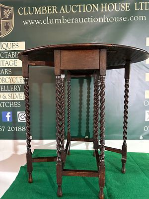 An English Barley Twist Oak Gate Leg Drop Leaf Table, Late 19th/Early 20th Century. An English 