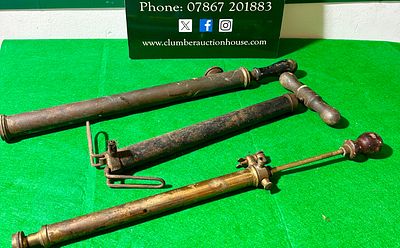Three Vintage Brass and Ferrous Metal Pump Sprayers. Three vintage hand-operated pump-action 