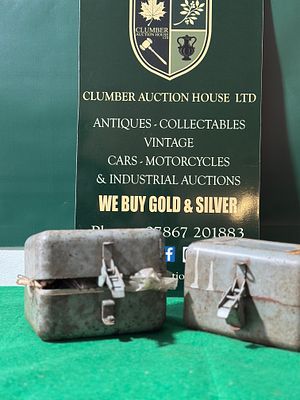 A Pair of Utilitarian Metal Boxes with Contents. A pair of rectangular, hinged metal boxes 