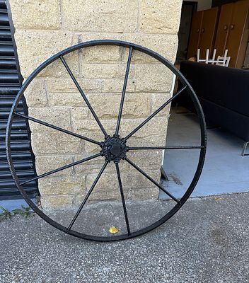 A Large Antique Cast Iron Wheel, by Richmond Foundry. A large, robust spoked wheel crafted from 