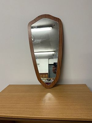 A Mid-Century Modern Asymmetrical Wall Mirror, possibly Teak, circa 1960s. A Mid-Century Modern 