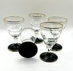 A Set of Five Mid-20th Century Clear and Black Glass Stemmed Glasses with Gold-Tone Accents. This Image - 1