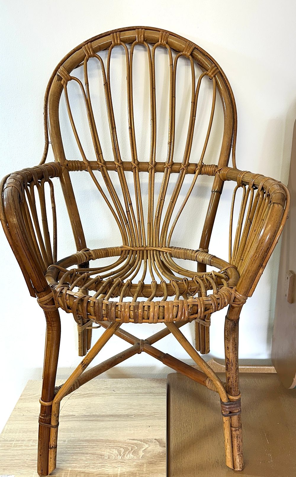 A Mid-Century Rattan Armchair. A mid-20th century armchair constructed from bent rattan and 