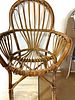 A Mid-Century Rattan Armchair. A mid-20th century armchair constructed from bent rattan and Image - 1