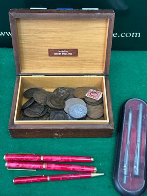 A Collection of British Imperial Coins, Lesney Model Car, and Writing Instruments in a Lesney Box. 