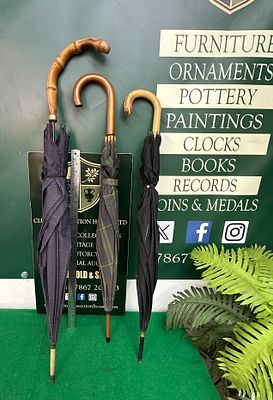 Three Vintage Umbrellas, including one with a Bamboo Handle and one with an Italian-Made Handle. 