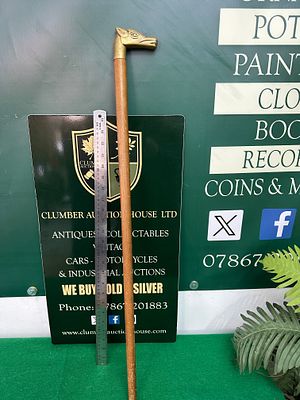 A Vintage Wood Walking Stick with Brass Equine Head Handle. This item is a walking stick or cane 