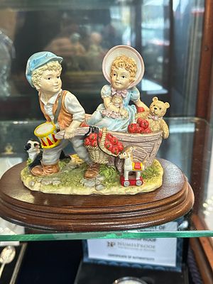 The Leonardo Collection 'Playing In The Orchard' Figurine Group, dated 1992. A hand-painted 
