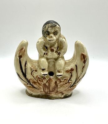 A Glazed Earthenware Figural Monkey Incense Burner. A glazed earthenware figural object 