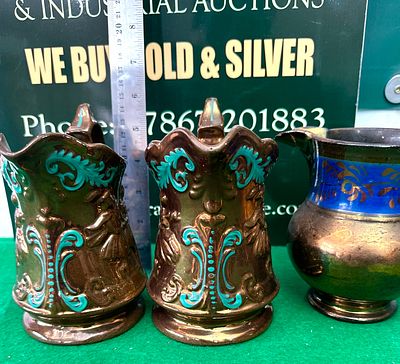 Three Antique Copper Lustre Pitchers. A group of three antique copper lustre pitchers, all 