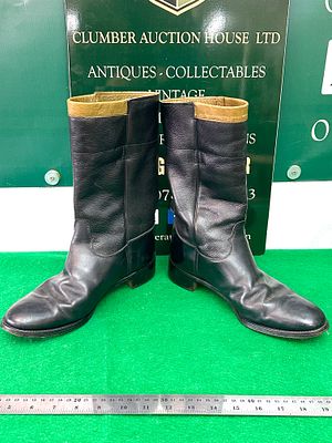 A Pair of Black Leather Riding or Uniform Boots. A pair of mid-calf, pull-on style boots 