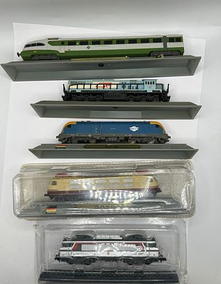A Collection of N-Scale Model Train Locomotives and Tender, Representing Various International 