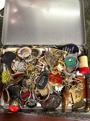 A Collection of Approximately 50-70 Vintage and Eclectic Keychains in a Metal Box. A rectangular 