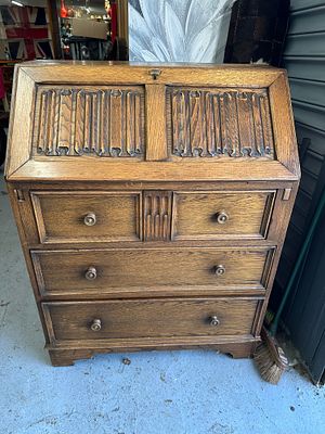 A Vintage Oak 'Old Charm Style' Fall-Front Bureau. A vintage fall-front bureau crafted in the 