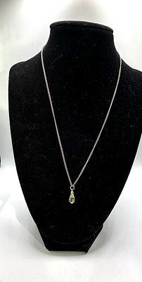 925 Silver Peridot Teardrop Pendant Necklace. A 925 silver necklace featuring a teardrop-shaped 