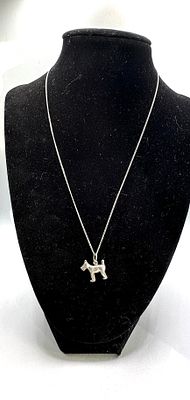 A 925 Sterling Silver 3D Terrier Dog Pendant Necklace. The necklace features a silver-toned 