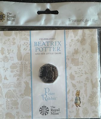 The Royal Mint Beatrix Potter Peter Rabbit 50p Brilliant Uncirculated Coin. A Royal Mint Beatrix 