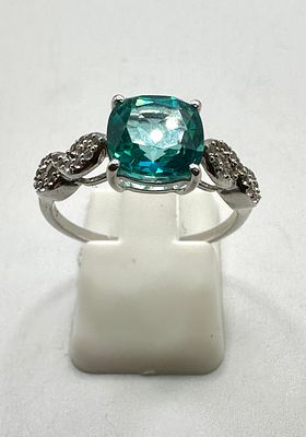 A Contemporary White Metal Ring with a Cushion-Cut Tourmaline and stone Accents. A 