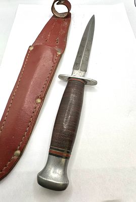 A WW2 Period British Fighting Knife by William Rodgers, featuring a fixed-blade dagger or 
