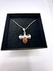 A Baltic Amber and 925 Silver Bee Pendant Necklace. A pendant necklace featuring a stylized bee Image - 1