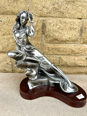Alice Heath for Austin Productions Silver-Toned Figurine of a Reclining Woman. A contemporary 