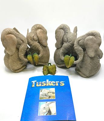 A Collection of Tuskers The Adventures of Henry the Elephant Figurines. A collection of Tuskers 