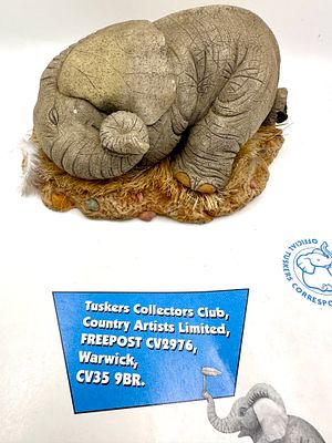 Country Artists Tuskers Elephant Figurine All Curled Up Model 91209. A cast resin collectible 