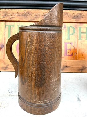A Vintage Staved Wood Harvest Jug. A vintage wooden harvest jug of cylindrical form, featuring 
