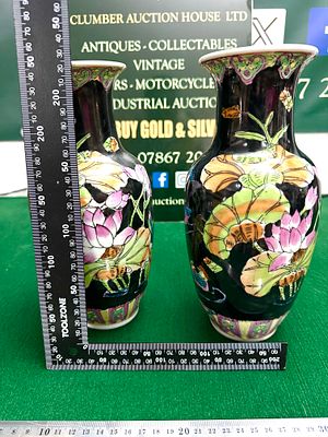 A Pair of Chinese Famille Noire Style Porcelain Vases. A pair of Chinese porcelain vases 