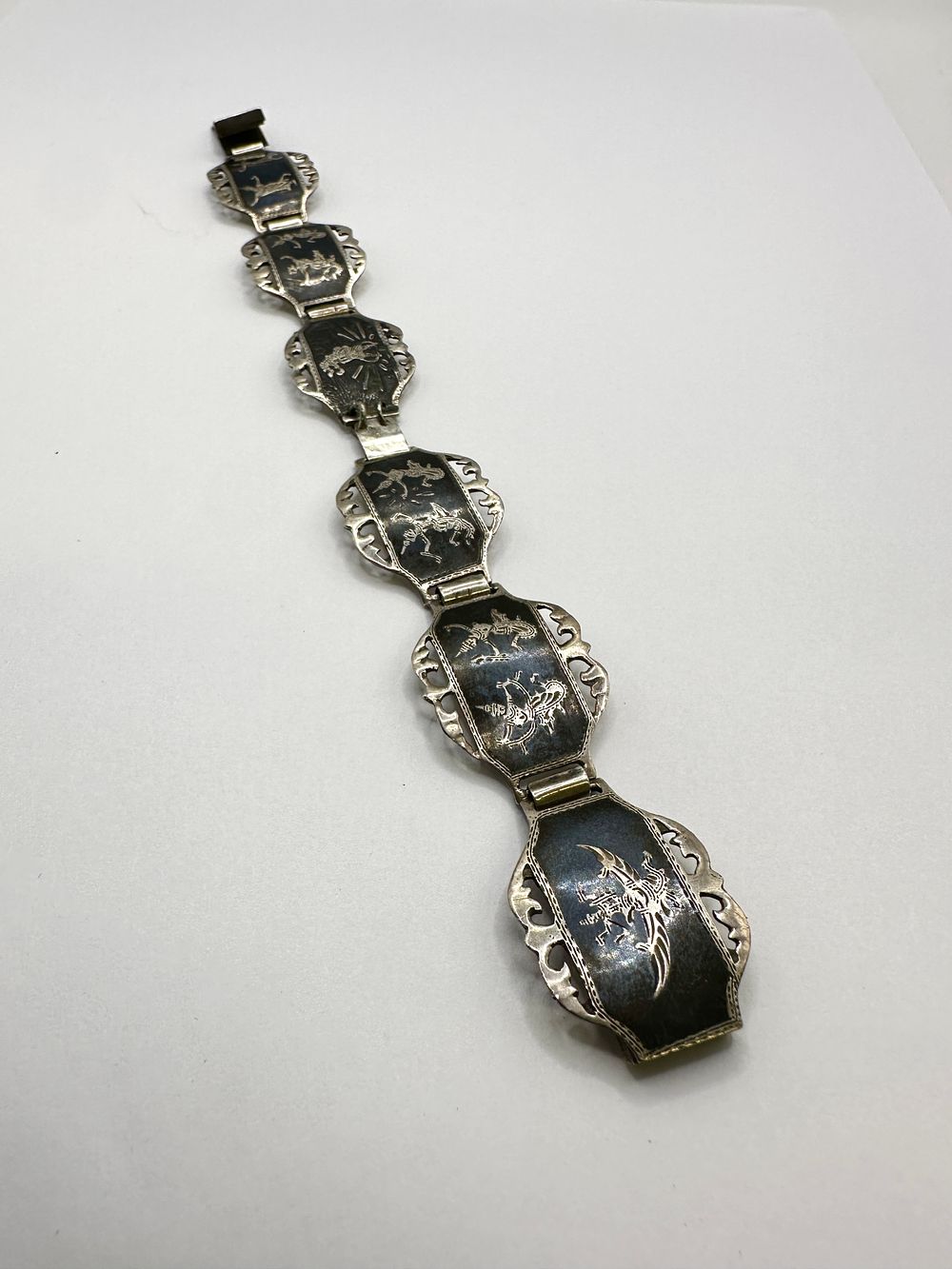 A Siamese 925 Silver and Niello Dancer Bracelet by Amargo. A Siamese 925 silver and niello link 