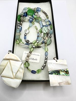 A Trio of Contemporary Jewellery Comprising a Beaded Necklace and Two Shell Pendants. A 