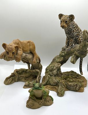 A Trio of Hand-Painted Resin Wildlife Figurines. A trio of hand-painted wildlife figurines 