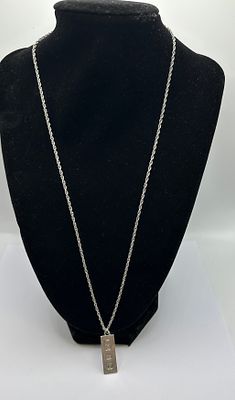 A Elizabeth II Sterling Silver Ingot Pendant Necklace. A 925 silver necklace featuring a 