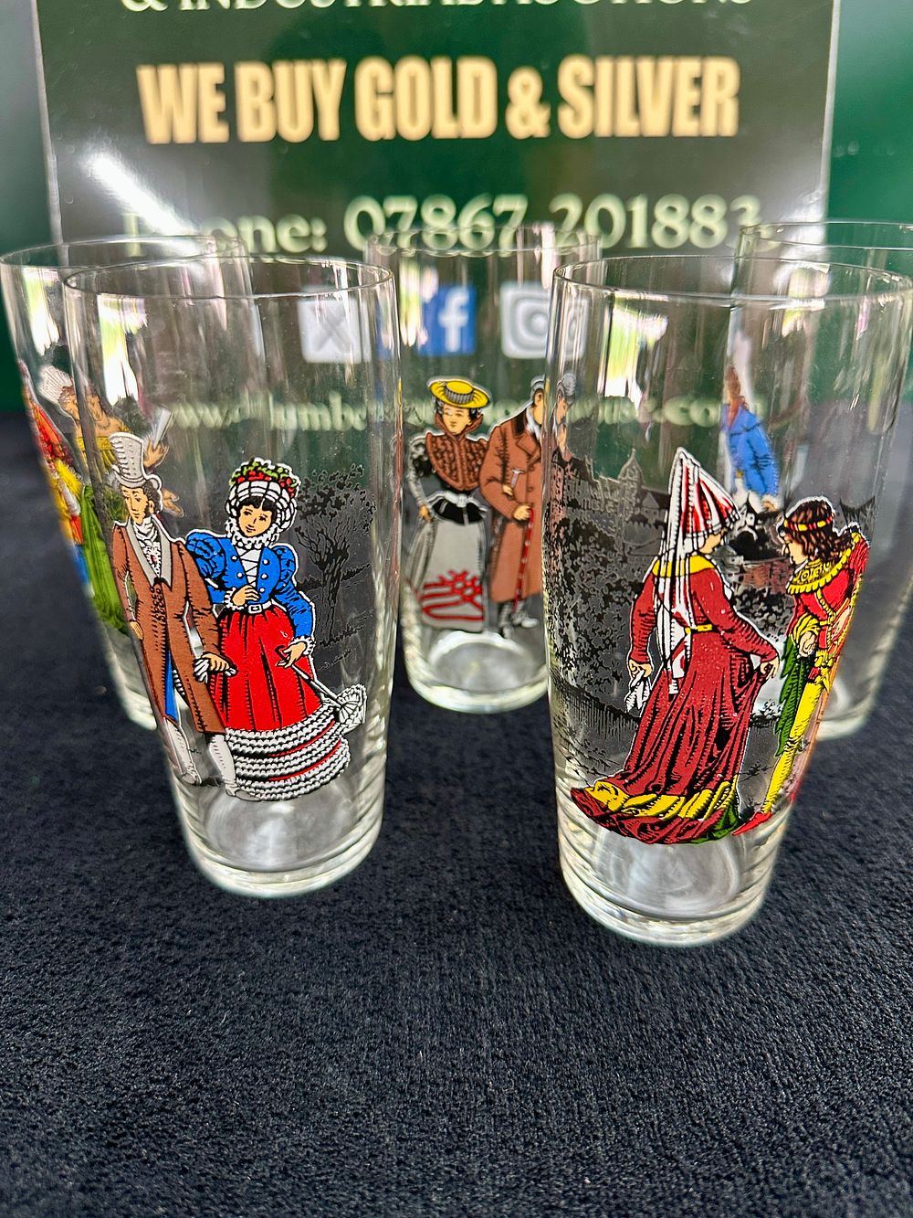 Lot 330: A set of five vintage highball glasses decorated with historical costume transfers