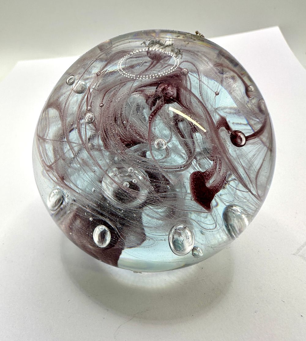 Lot 208: Contemporary Art Glass Paperweight with Burgundy Swirls and Controlled Bubbles