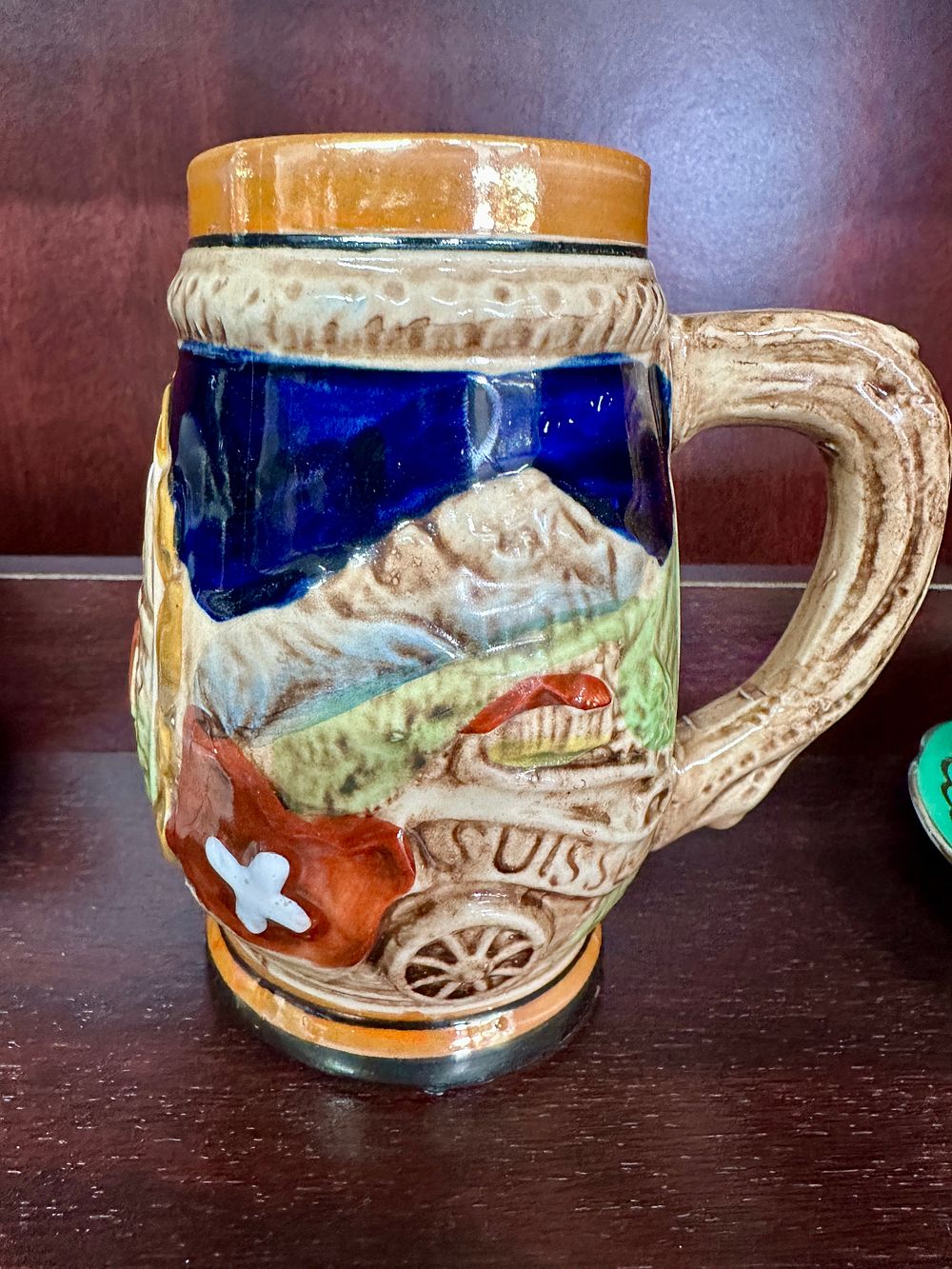 Lot 213: Vintage Swiss Souvenir Relief-Molded Ceramic Mug