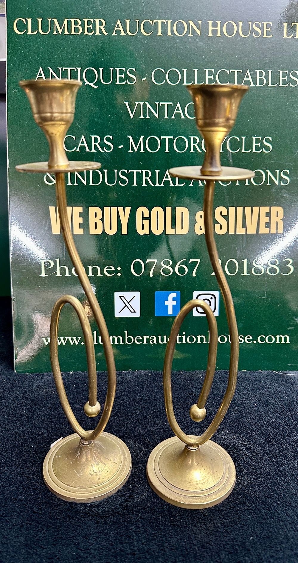 Lot 371: A Pair of Modernist Brass S-Scroll Candlesticks