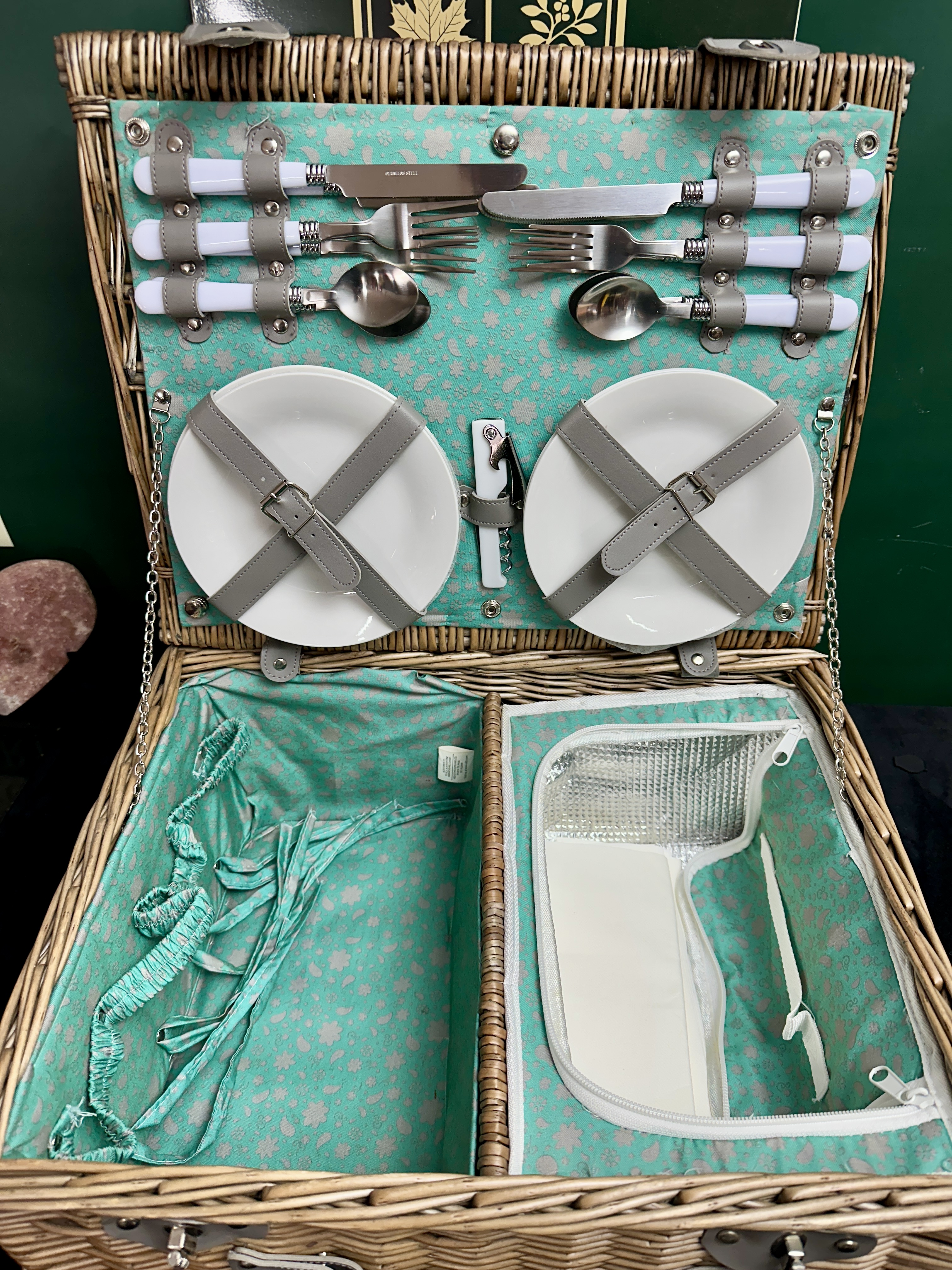 A contemporary woven wicker picnic hamper