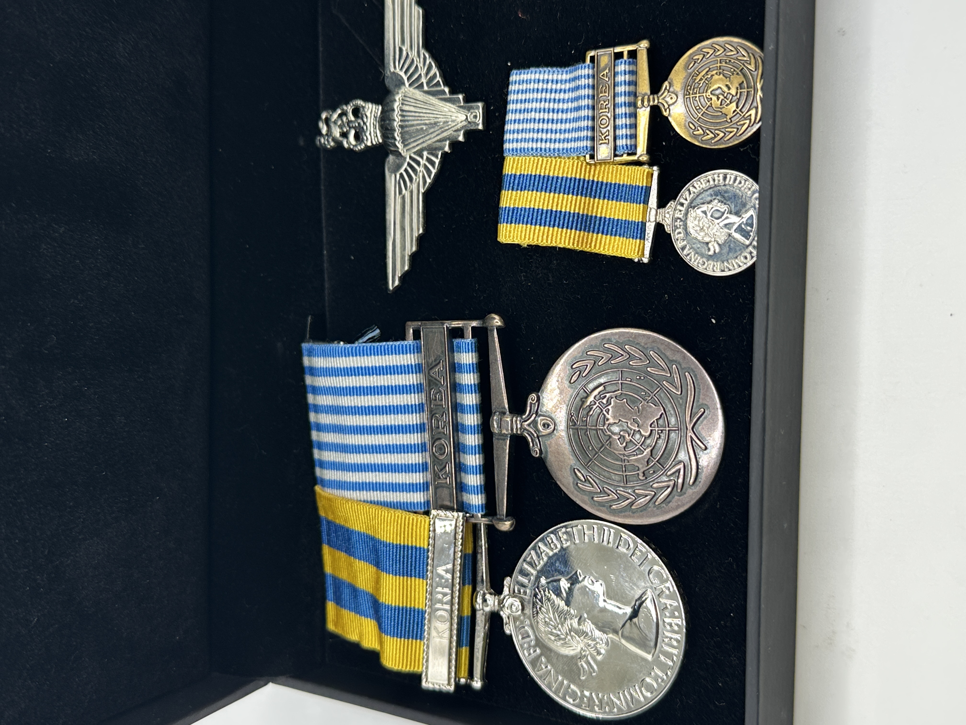 A Group of British Korean War Medals and Parachute Regiment Insignia