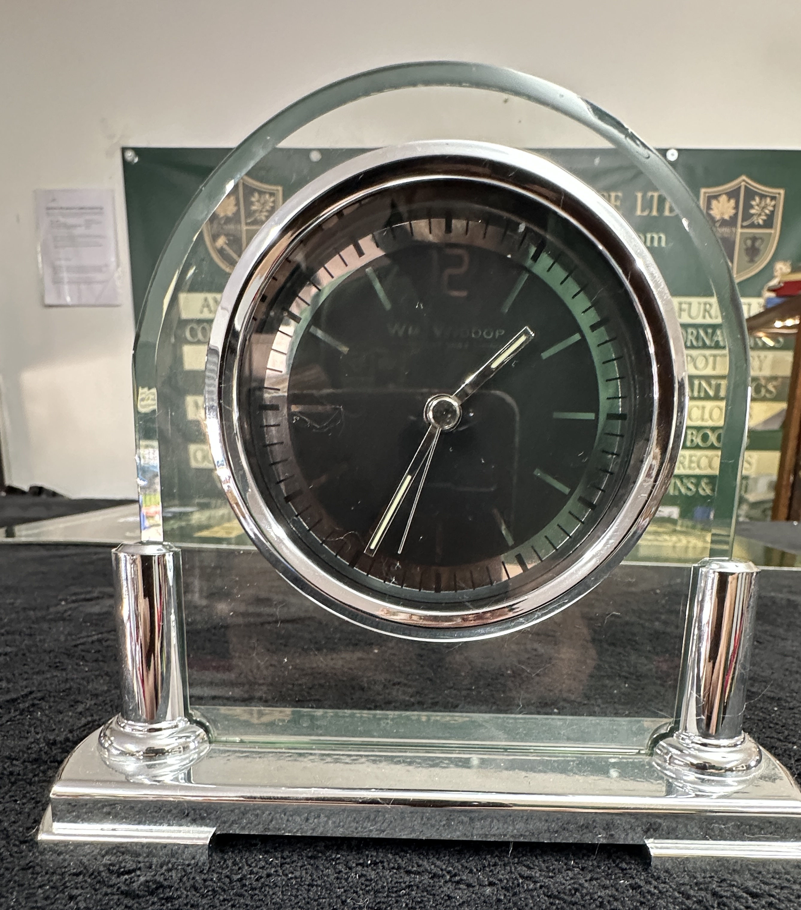 A Wm Widdop Glass and Silver-Toned Arched Mantel Clock