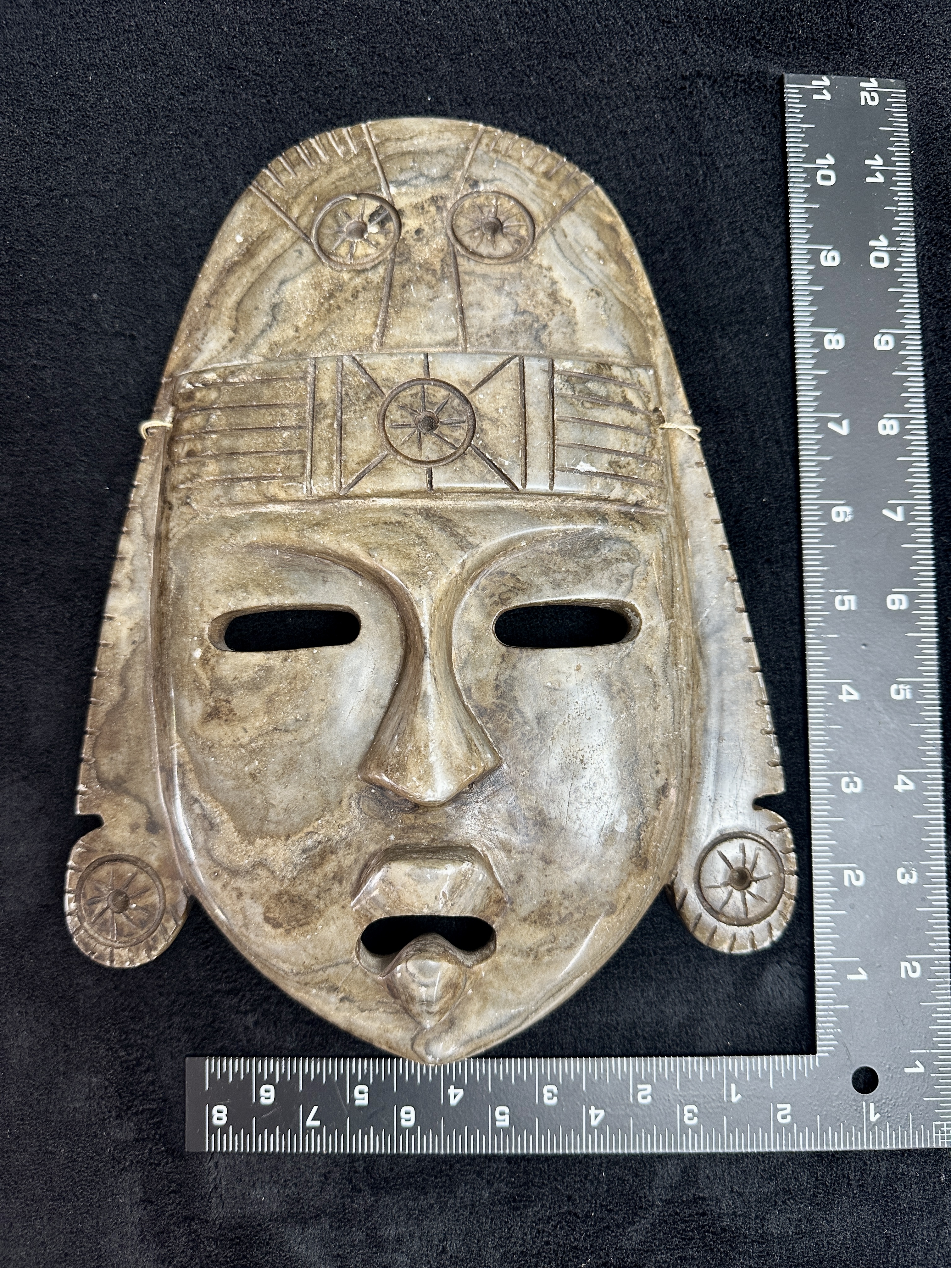 A Carved Banded Stone Mask in the Mayan Style
