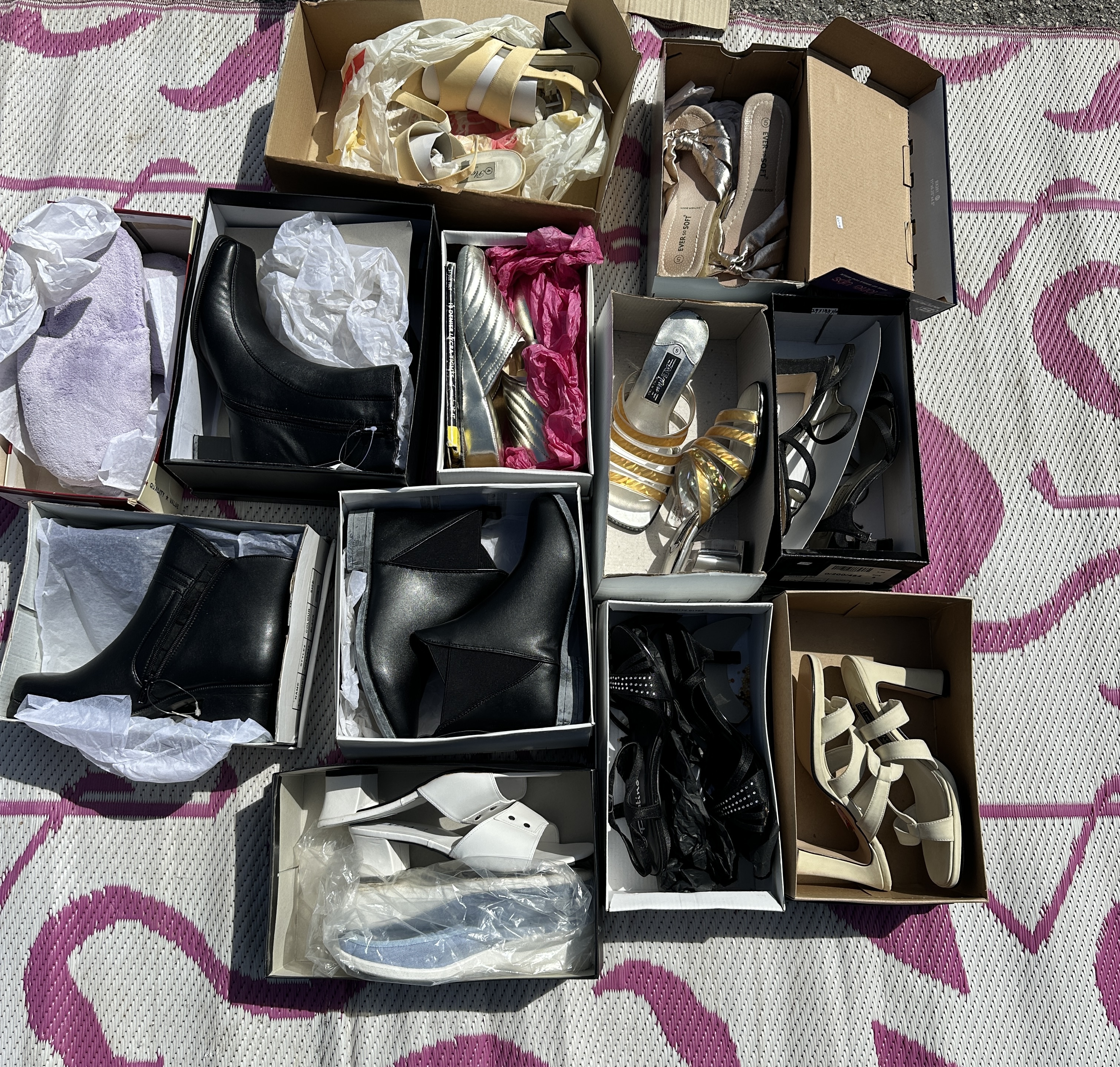 An Assortment of Twelve Pairs of Women's Footwear Including Boots Sandals and Slippers