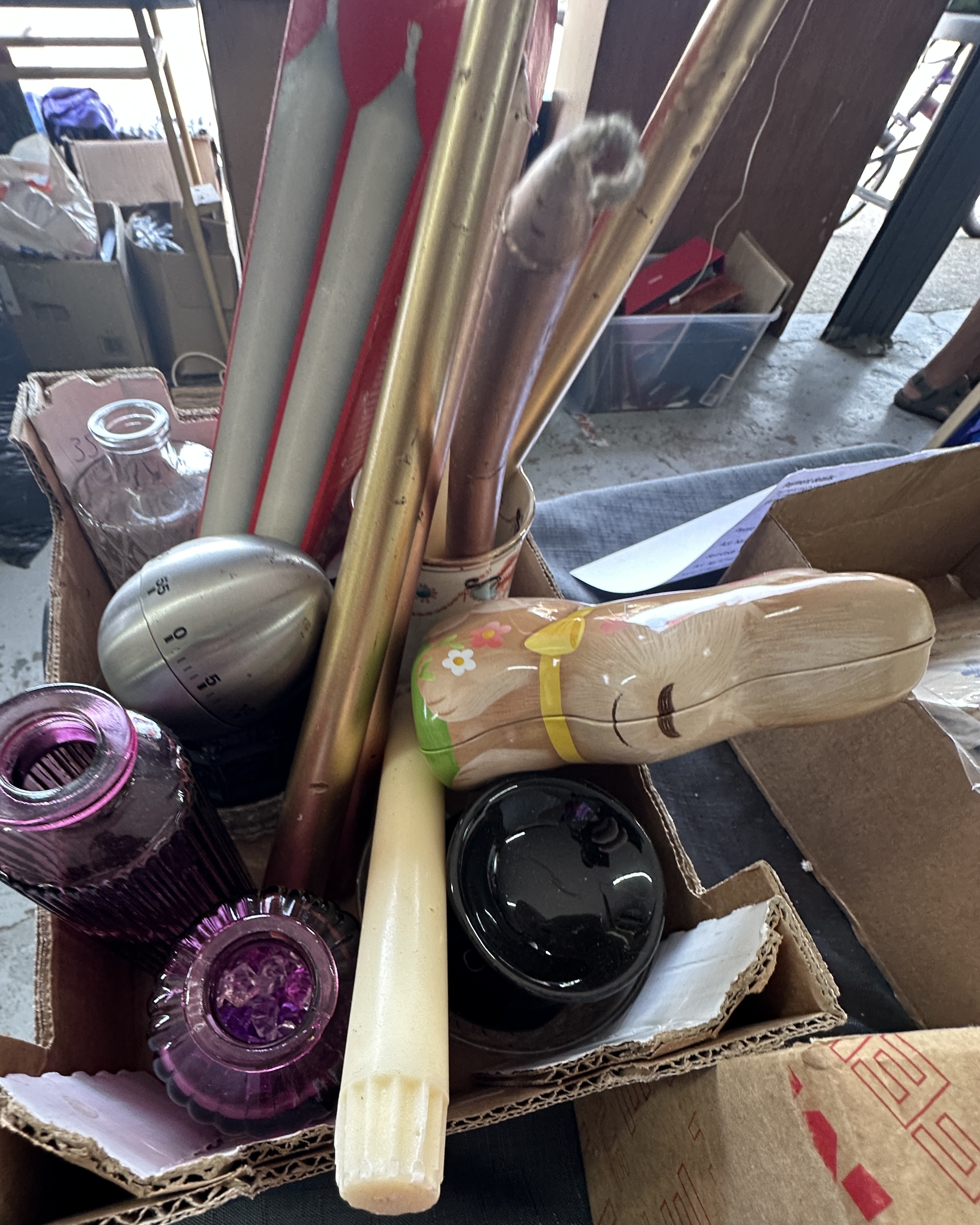 An Assortment of Household and Decorative Items Including a Kitchen Timer and Candles