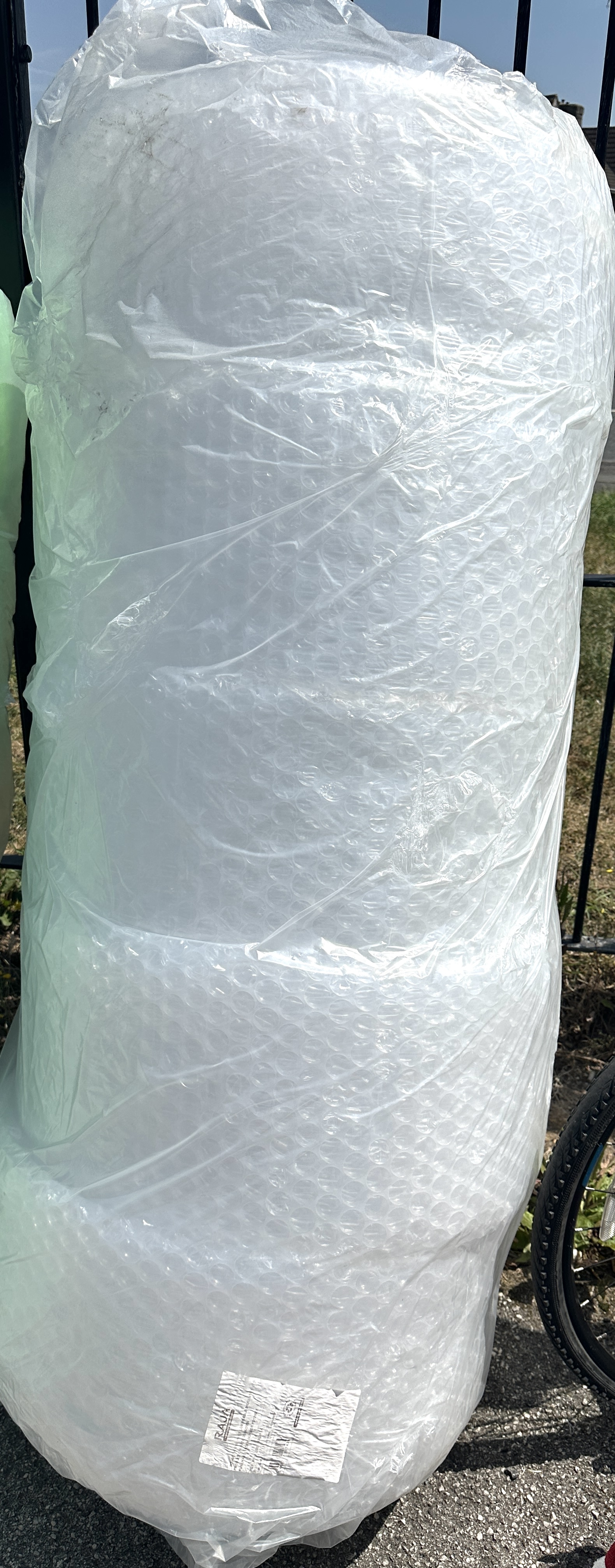 A large roll of RAJA clear bubble wrap protective packaging