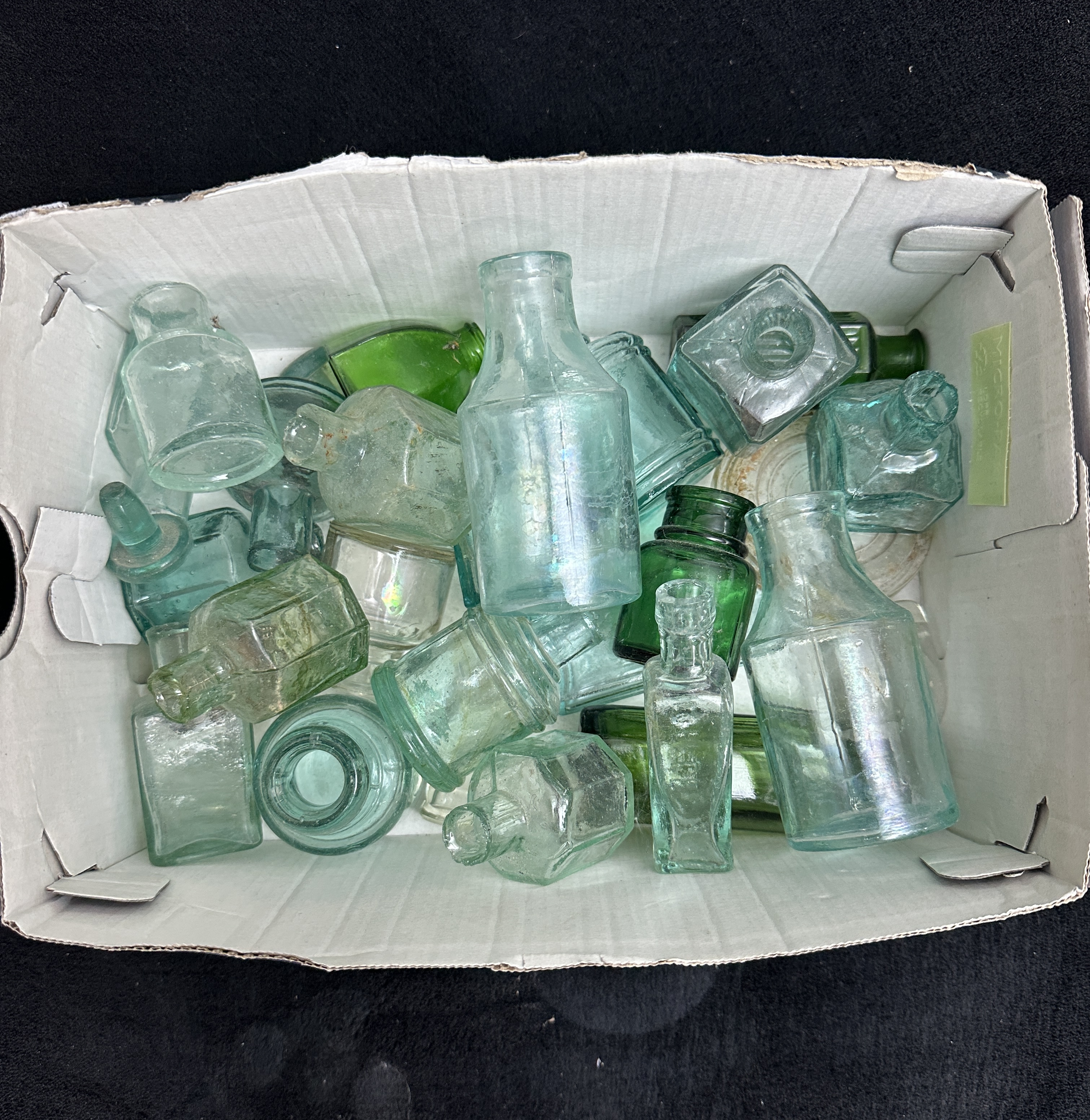 A Collection of approximately 22 Victorian and Edwardian Glass Bottles and Inkwells