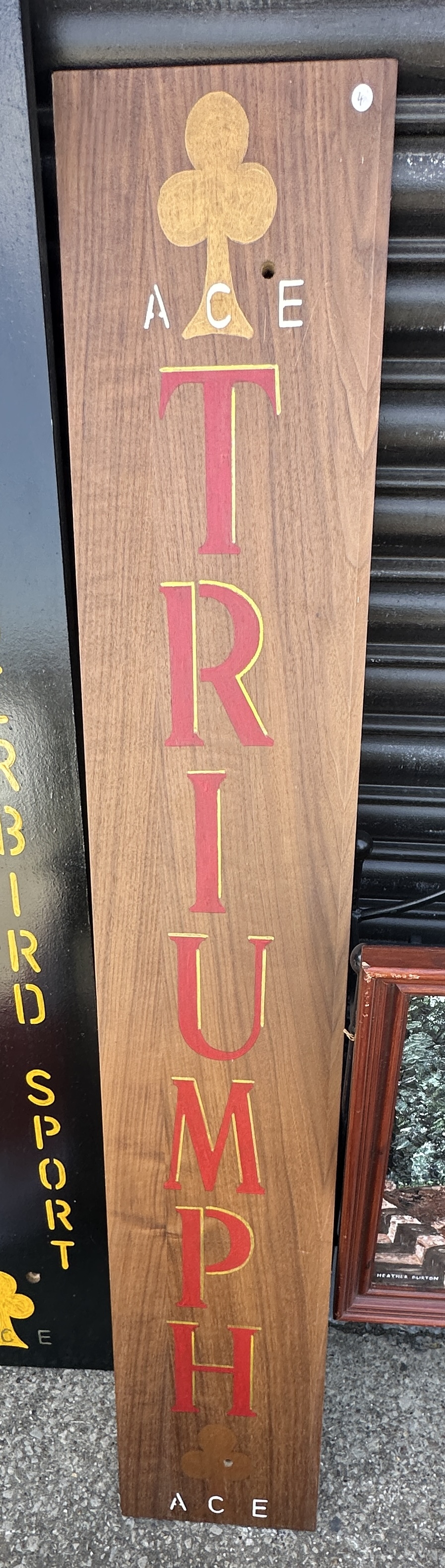 A Vertical Painted Wooden Advertising Sign for Triumph and Ace Cafe
